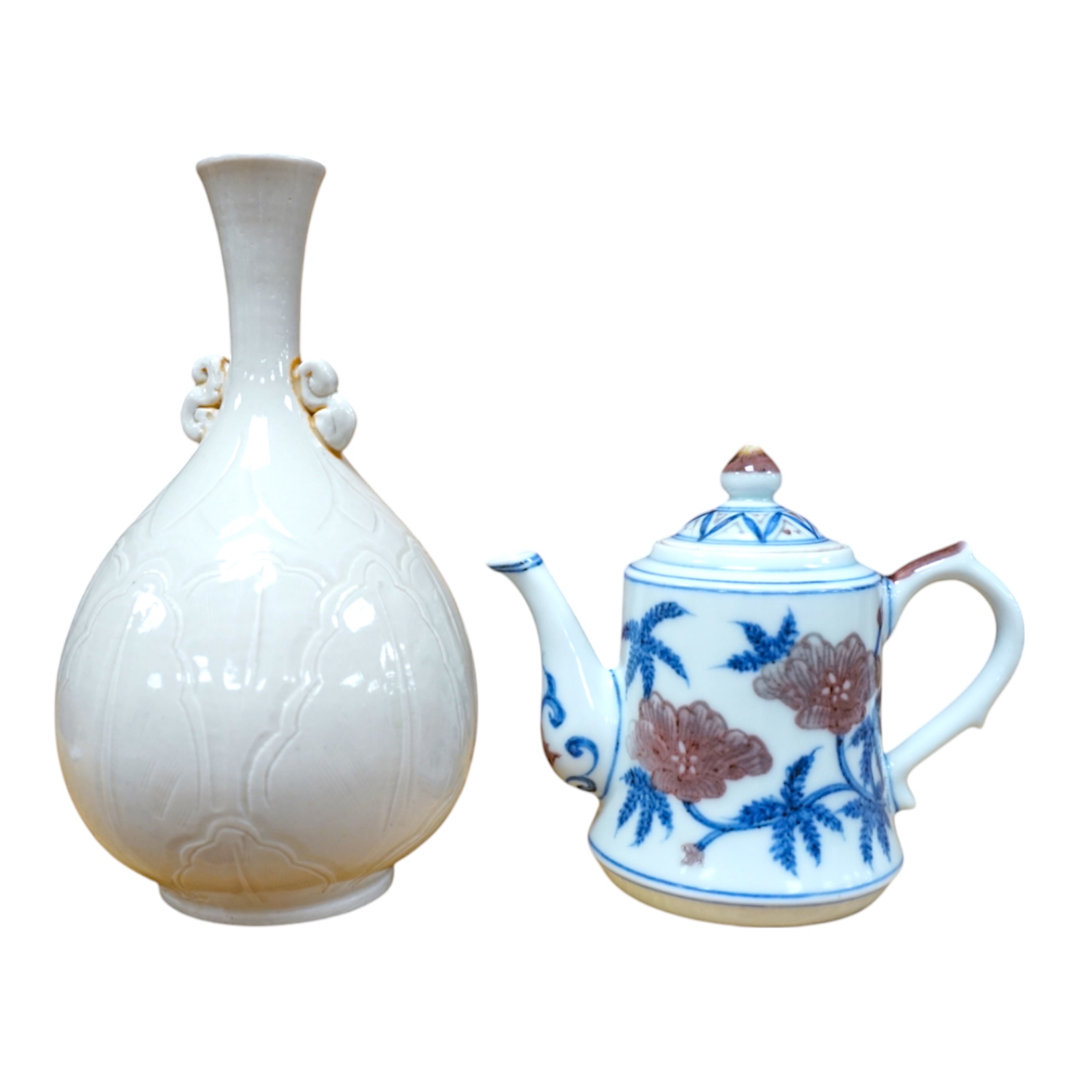 A Chinese carved bottle vase, 18cm high, and a small teapot. Condition - fair to good.